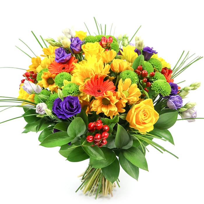 A lush, rounded bouquet appears against a bright white background, every bloom clearly defined so that its colours and textures seem to leap forward, much like a vibrant display in a favourite Gerrards Cross florist's window. The arrangement is dominated by a joyful yellow palette: generous roses with tightly furled, spiralling petals sit alongside full-headed yellow chrysanthemums and smaller daisy-style flowers, together creating a halo of sunshine tones that immediately suggest warmth, optimism, and celebration. Interspersed in skilful balance, vivid orange gerbera daisies stretch their tidy rings of petals outward, each flower centred by a slightly deeper eye that gives the design a lively, contemporary character. Running through this warm spectrum, deep purple lisianthus blooms introduce an elegant contrast; their soft, layered petals are reminiscent of miniature roses, while a few lighter lavender buds hint at flowers still waiting to open. Pops of lime-green button chrysanthemums are tucked throughout the bouquet, their compact, spherical heads adding playful texture and a crisp, grassy freshness that echoes the green spaces around Gerrards Cross's Austenwood area. Clusters of glossy, ruby-red hypericum berries nestle among the petals, offering subtle shine and a festive note without overpowering the main blooms. Fine, upright blades of ornamental grass rise and curve gracefully above, suggesting movement and air, while a backing of broad, dark green foliage forms a strong, polished collar that frames the brighter flowers beautifully. The bare stems, neatly gathered and tied at the base, underline the piece's hand-tied craftsmanship, as though it has just been prepared for same-day delivery to a nearby home off Packhorse Road. Overall, the bouquet conveys an impression of well-balanced abundance-perfect for birthdays, thank-you gifts, or simply brightening a living room with a touch of cheerful, garden-inspired luxury.