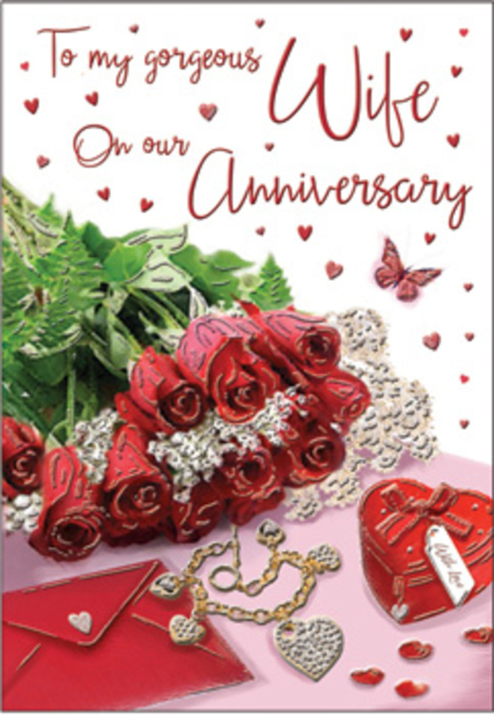 In this romantic anniversary card image, the viewer is invited into an intimate still life that could easily be found on a breakfast table in a Gerrards Cross home overlooking Colne Valley. At the centre, a compact bouquet of red roses opens generously, each flower fully formed, its petals layered in sumptuous spirals of deep, velvety crimson. The roses sit low on the surface, intertwined with lush green leaves that offer a fresh, natural contrast to the passionate reds. Nearby, a carefully placed envelope in soft ivory rests at a gentle angle, its flap slightly lifted as though waiting to reveal a heartfelt message. A small piece of jewellery-a fine chain or delicate bracelet-catches the soft daylight with subtle reflections, lying close to a smooth, heart-shaped keepsake box in matching red tones that echo the roses' intensity. The card's surface is scattered with tiny heart embellishments and sparkling accents, arranged like confetti after a quiet celebration, their shimmer resembling evening lights along Packhorse Road. A single butterfly motif appears within the design, light and graceful, adding a sense of fleeting magic, much like a favourite moment revisited year after year. Elegant, flowing script runs across part of the card, its curves harmonising with the rounded petals and heart shapes. The overall lighting is gentle and diffused, casting soft shadows that deepen the scene's intimacy. It feels like an anniversary vignette thoughtfully styled by a local florist, evoking warmth, gratitude, and the quiet confidence of a love that has grown over time in Gerrards Cross.