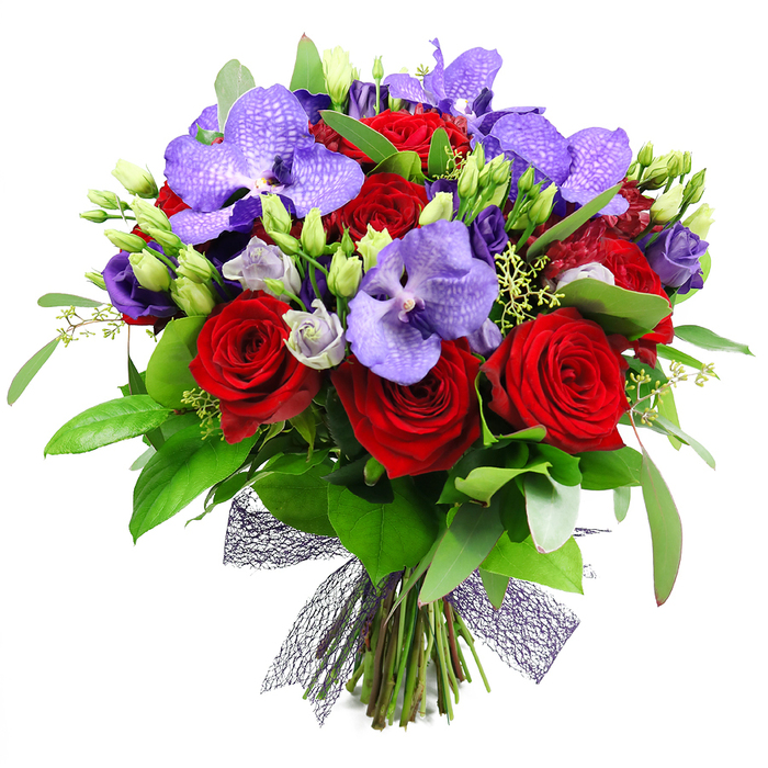 Crafted with quiet confidence by a Gerrards Cross florist, this hand-tied bouquet commands attention against a crisp white background. Deep red roses rise at the center, their velvety petals spiraling in a classic, romantic bloom. Interspersed are splendid purple Vanda orchids, their broad, flat petals marked with a speckled pattern that speaks of luxury. Adding depth are clusters of Lisianthus in soft purples, their buds tight and inviting, lending a gentle lavender glow to the composition. The arrangement blooms with generous greenery-broad, glossy leaves for drama and slender sprigs of foliage that mimic a garden at dawn-while numerous unopened buds promise continued vitality. The stems are neatly bound at the base and finished with a dark, near-black mesh ribbon that threads through the stems, giving the piece a modern, architectural edge. This opulent display evokes romance, celebration, and refined taste, ideal for anniversaries, Valentine's gestures, or a luxurious table centerpiece in a Gerrards Cross soirée or at a home gathering near Gerrards Cross Common. Available for same-day delivery in Gerrards Cross and surrounding villages, this bouquet brings enduring elegance and a sense of grand occasion to every room.