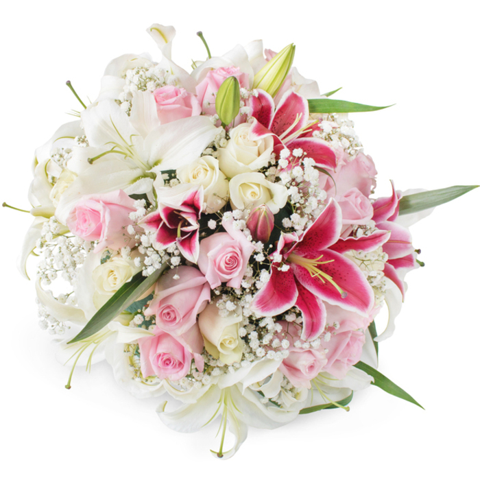 A sumptuous, round bouquet of mixed lilies and roses is shown in full detail against a plain white backdrop, allowing every petal and stem to stand out with clarity, as though freshly prepared in a Gerrards Cross flower studio. Large white lilies form the structural backbone of the design, their long, sculpted petals opening in generous trumpets that reveal subtle greenish throats and neat, pale stamens. Interlaced among these are numerous blush pink and cream roses, some still tightly furled like small, promise-filled buds, others opening into layered, velvety rosettes that add softness and romance. Scattered throughout are several striking, magenta-toned Oriental lilies, very much in the Stargazer style, whose rich fuchsia petals are flushed with darker speckles and curve back to expose prominent yellow anthers, creating vivid focal points amid the paler blooms. Wisps of delicate white baby's breath, or Gypsophila, drift between the larger flowers, their clouds of tiny blossoms forming a gentle halo that lightens the overall effect and enhances the bouquet's airy, celebratory mood. Subtle touches of green foliage peep out from beneath the mound of flowers, providing a natural frame and hinting at the stems that hold this generous design together. Bright, even lighting highlights the plush textures and clean colours, from ivory and cream to warm pink and bold magenta, suggesting a bouquet that smells softly sweet and feels luxuriously full in the hands. This arrangement would be perfectly at home as a wedding gift for a ceremony near Gerrards Cross station, an anniversary surprise delivered to one of the leafy roads off Oxford Road, or a heartfelt gesture of appreciation for someone special in the wider South Bucks community.