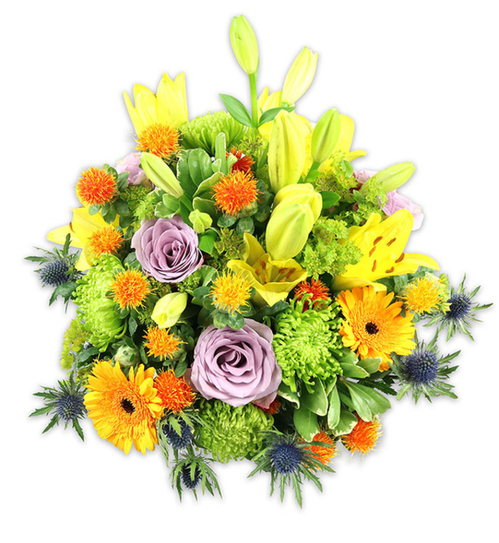 Carefully photographed on a crisp white backdrop to emphasise colour and form, this abundant floral composition is a study in contrast and harmony. Towering yellow Asiatic lilies provide vertical punctuation: several are fully open, their speckled petals and prominent stamens visible, while others stand as elongated buds that give a sense of unfolding motion. Two or three soft lavender-purple roses occupy the centre, their velvet petals unfurling in slow spirals and introducing a calm, classical note amid the warmer tones. Large orange Gerbera daisies, with their flat, radiating petals and darker centres, scatter cheer throughout the bouquet and create focal points at varying heights. Bright lime-green button chrysanthemums fill the spaces with ruffled, cushion-like clusters, creating a plush textural bed that enhances the arrangement's perceived abundance. Small, globe-shaped orange and golden yellow accent flowers-suggestive of billy buttons or similarly structured blooms-add spiky, playful contrast. Cool-toned Eryngium thistles appear at the composition's perimeter, their indigo-blue spheres and spiky bracts offering an unexpected, sculptural coolness that plays against the warm palette. Multiple leaf shapes-broad lily foliage and smaller glossy greens-wrap and cradle the florals, adding depth and a verdant frame. Gentle, naturalistic lighting reveals subtle petal translucence and the soft scent of lilies and roses. As a finished piece, this bouquet reads as celebratory, comforting and elegant-equally suited to a sunny birthday table on a weekend near The Green in Gerrards Cross or as a refined gift to mark an important life moment.