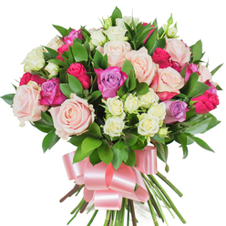 This radiant, densely packed bouquet reads like a quiet love letter in flowers, captured against a clean white background so every nuance of colour and texture is clear. The composition centres on generous, velvety roses in soft blush pink and creamy white - some petals unfurled into open rosettes, others curled into elegant buds - releasing an almost imagined scent that is faintly rosy with a fresh, green lift. Vibrant magenta-pink roses punctuate the arrangement with bright optimism, and a handful of pale lavender roses lends a cool, calming note that balances the warmer tones. Interwoven are sprays of petite white cluster roses, their tiny faces adding texture and a dancing rhythm to the larger blooms. Deep green, glossy foliage-probably ruscus or salal-breathes life between the flowers, its elongated leaves sculpting gentle negative space and enriching the bouquet's three-dimensional feel. At the stems, a wide, silky pink satin ribbon is tied into a sweeping bow; the ribbon's sheen catches light and lends the bouquet an elegant, gift-ready finish. This arrangement is crafted for tender milestones and joyful celebrations-Mother's Day, anniversaries, or a heartfelt birthday surprise-and is the kind of bouquet often requested by local residents for delivery within Gerrards Cross and neighbouring Burnham or Chalfont St Peter. The overall impression is one of refined abundance, a floral embrace that reads as both contemporary and timeless.