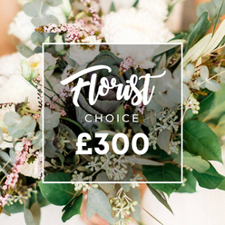 Imagine stepping into a sunlit corner of Gerrards Cross, where this 'Florist Choice' bouquet becomes a living sculpture of cream and ivory. The eye is drawn to several large, full-petaled blooms-likely garden roses, peonies, or chrysanthemums-radiating quiet luxury as their petals unfold. They are offset by generous wisps of small white flowers, lisianthus or campanula, which weave through the arrangement with airy grace. The greenery is tactile and lush: rounded, silvery eucalyptus leaves, slender olive branches that add warmth and depth, and pale green buds or berries that catch the light in soft, speckled glints. In the heart sits a darker green, almost purplish ornamental kale or a distinctive succulent head, providing a contemporary counterpoint that catches the eye without overpowering the softness around it. The bouquet is arranged in an unforced, naturalistic style, as if plucked from a cottage garden near Gerrards Cross and then artfully mounted against a warm peach-cream bokeh. A crisp white rectangular overlay sits at the center, with 'Florist Choice'-'Florist' in a graceful flowing script and 'CHOICE' in a clean uppercase font-followed by the large '?300' price. This is a celebration of craftsmanship: premium stems, careful balance, and the confidence of a local florist who understands the moment a gift becomes memory. Perfect for sophisticated occasions, intimate celebrations, or a thoughtful gesture delivered to Gerrards Cross homes the very same day, keeping freshness at the heart of every stem.