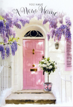 A sunlit entranceway in Gerrards Cross captures the hush and excitement of move-in day, the kind that follows a walk back from the shops on Station Road with a new set of keys in your hand. The eye is first drawn to a whimsically painted pink door, its soft blush colour gently weathered, framed by whitewashed walls that reflect the mellow afternoon light. Overhead, mature wisteria drapes in lavish lavender and lilac clusters, each blossom forming feathery curtains that tumble toward the door, creating a natural floral archway. The blooms look heavy with perfume, as if you could almost feel their silky touch while stepping inside from a nearby stroll across East Common. To one side, a pale shutter is brushed with the same pastel tones, tying the frontage together with an easy, airy elegance. On the doorstep rests a chic grey tin bucket, carefully filled with plump white and cream roses. Their petals are full and layered, edged in the faintest hint of ivory, nestled amongst soft green foliage that adds movement and depth. A dusky pink ribbon cinches the bucket, its satin sheen catching a glimmer of light, like a quiet nod to celebration. The composition has a tender balance: the cascading wisteria above, the rounded roses below, the solid door at the centre. It feels like a still image of joy and calm anticipation, the kind of flowers local Gerrards Cross florists prepare for a housewarming just off Bulstrode Way-an arrangement meant to greet each arrival with warmth, grace, and the unmistakable welcome of fresh blooms.
