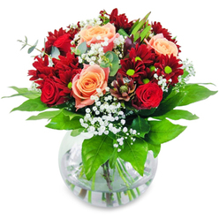 Picture yourself holding this resplendent bouquet, designed with artistry and attention to detail in the heart of Gerrards Cross by a local florist. The deep, velvety reds of chrysanthemums and full-bloom roses stand out in striking harmony, while shades of apricot and salmon gently soften the effect with a delightful, sunlit glow. Interspersed among these, subtle sprays of white gypsophila are reminiscent of the first frosts settling on pine along West Common-adding lightness and grace. The arrangement is ringed by fresh green foliage, their crisp, earthy scent mingling with the sweet aroma of open roses, evoking the sensation of a summer stroll through Gerrards Cross Memorial Gardens. Nestled in a pristine glass vase, each sturdy stem is immersed in fresh water, reflecting clarity and life much like the nearby Misbourne river. The composition is masterfully balanced-abundant yet thoughtfully contained, ideal for centre stage at family dinners or intimate celebrations. Its fragrance uplifts the senses, the tactile pleasure of velvety petals contrasting with airy gypsophila and firm, glossy greens. Whether delivered for a birthday, heartfelt congratulations, or to simply express affection, this bouquet radiates sincerity, handcrafted by experienced florists who weave the gentle character of Gerrards Cross into every stem they arrange.