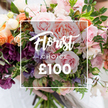 A lush, hand-tied 'Florist Choice' bouquet fills the frame, captured in soft, natural light that brings out the velvety textures and fresh scent of each bloom. At the centre of the image a thin white rectangular frame is superimposed over the flowers, its elegant script declaring Florist Choice, the word CHOICE in smaller uppercase beneath, and a bold ?100 set clearly at the bottom - a simple, refined label for this florist-selected offering. The arrangement itself reads like a small English garden: several large garden roses in a pale, blushing pink dominate the composition with ruffled, peony-like layers; nearby, soft peach and coral ranunculus add warm, luminous pockets of colour. Deep plum-toned hellebore-like florets or similar textured blooms tuck into the lower clusters, giving weight and depth, while delicate, striped pale purple-and-white sweet peas float above with a subtle fragrance. Creamy white accent flowers and varied green foliage - from slender trailing vines to broader, matte leaves - weave through the bouquet, creating movement and an organic, garden-style silhouette. A pair of hands gently cradle the stems at the bottom, a pale sleeve and blurred clothing in the background suggesting careful handling and human warmth. The overall mood is romantic and artisanal, a bespoke gift that promises freshness and careful curation from a local florist in Gerrards Cross, perfect for anniversaries, weddings, or an intimate celebration. The composition and the clear price overlay make this visually accessible and reassuring for anyone choosing a premium, florist-selected bouquet for delivery in the local area.