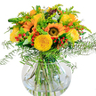 This bouquet channels the warmth of Gerrards Cross in high summer, its artistry rooted in the rich colours and welcoming spirit of the community. Sunflowers with golden petals and velvety brown faces reach outward, echoing fields touched by the sun near Bulstrode Park. Tucked among their bold forms are elegant yellow garden roses, their spirals of petals unfolding with a soft, glowing light. Bright red Hypericum berries create playful punctuation marks throughout, their glossy orbs a vivid contrast to the sea of green foliage. Feathery ferns gracefully cascade over the edge of the arrangement, their movement recalling gentle breezes along the tranquil walks of Gerrards Cross. Sprays of goldenrod or similar yellow-green filler flowers, paired with slender, airy spires, impart a sense of softness and energy. Bluish eucalyptus leaves add subtle depth, completing a bouquet that feels both wild and beautifully curated. Cradled in a clear, round vase, the stems are displayed in water as pristine as the view from East Common. The arrangement's clean, sunlit presentation brings joy, making it a perfect gift for birthdays, anniversaries, or simply brightening someone's day in Gerrards Cross-each detail carefully chosen by local florists who take pride in capturing the essence of their home environment.