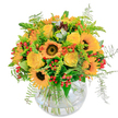 Capturing the spirited glow of a Gerrards Cross afternoon, this bouquet radiates joyful energy and seasonal warmth. Sunflowers take centre stage, their dark velvet hearts ringed by brilliant yellow petals that evoke the sunny meadows near King's End. Interlacing these are bright yellow roses, each bloom opening slowly, their creamy petals layered with gentle promise. Bursts of orange blossoms and glossy red berry clusters tuck into the greens, sparking lively contrast and infusing the display with a sense of playful movement, much like the bustling life along Station Road. Wispy ferns trail softly at the edges, their feather-light fronds swaying as if caught by a gentle countryside breeze. The entire composition rests in a round glass vase, its shape echoing the casual elegance cherished by locals. Fresher still is the fragrance-subtle, sweet, and tinged with the verdant scent of foliage-evoking the nearby open spaces of Gerrards Cross. Carefully designed to inspire happiness, this bouquet is ideal for a cheerful thank-you, a sunlit birthday, or simply to bring a golden touch to any home across our friendly town.