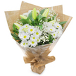 Set upright against a clean white backdrop, this hand-gathered bouquet reads as an ode to quiet simplicity: a generous cluster of bright white, daisy-like chrysanthemums with sunny yellow centres forms the heart, their many delicate petals fanning outward in soft, rhythmic layers. Among them rise pale green-yellow lily buds-some faintly striped-still tightly furled and promising tomorrow's larger, more sculpted blooms; their elongated forms add an elegant, vertical counterpoint to the rounded chrysanthemums. Wisps of tiny white baby's breath (Gypsophila) are woven through the arrangement like drifting clouds, lending a diaphanous, lace-like texture that softens the composition. Deep, glossy green foliage frames and anchors the flowers, enhancing the crisp white tones and giving the bouquet a fresh, verdant depth. The stems are gathered by hand and wrapped in an inner sheet of crinkled brown kraft paper that gives a comforting, rustic weight, then encased in a clear, glossy cellophane outer layer that catches soft studio light and protects the stems while keeping the palette airy and bright. The wrapping is neatly gathered and tied at the base, creating a compact, portable stand and a tidy hand-tied silhouette. In subtle scent there is a clean, green note-think cut grass after a shower-balanced by the gentle, powdery sweetness of the chrysanthemums and the cool, green promise of the lilies. As a local florist might suggest for a neighbourly token from Gerrards Cross High Street or a calm offering for a bedside, this bouquet conveys purity, reassurance, and hopeful restraint, suitable for sympathy, congratulations, or a quiet celebration of new beginnings.