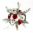 Gazing at this hand-tied arrangement, one is struck by the interplay of romance and serenity, as deep, velvety red roses command the center, their textured petals glowing with passion and poise. Encircling them, radiant white gerberas and fluffy spray chrysanthemums exude a luminous purity, softened further by fleeting touches of pale lilac lisianthus-each flower lending its own gentle story to the bouquet. The distinctive, silvery arcs of eucalyptus leaves set an airy, modern tone, their subtle aroma and rounded forms evoking the invigorating freshness of nearby Chalfont Park at dawn. Additional accents of green foliage peek through, offering natural depth and articulate movement to the presentation. This meticulously crafted bouquet, suffused with both classic glamour and understated polish, feels perfectly attuned to occasions cherished in Gerrards Cross-be it an intimate anniversary, an uplifting birthday surprise, or a moment of heartfelt remembrance. Under pure, even daylight, the textures and palette come alive: rich velvets, feather-soft petals, and glistening greens harmonise, transforming any local home or gathering into a space filled with warmth and enduring beauty.