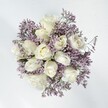 This bouquet radiates serene beauty and understated sophistication-an artful gathering of creamy white roses embraced by a gentle cloud of lavender statice. The velvety roses open slowly, each one revealing its soft, luminous heart, while sprays of statice arch and intertwine, their tiny blossoms forming wispy contours reminiscent of spring breezes playing across Gerrards Cross Memorial Green. Set in natural daylight, the white and violet palette feels pure and full of hope, embodying fresh beginnings and enduring affection. The combination of plush roses and the papery delicacy of the statice offers a rich textural experience both to the hand and the eye, creating quiet enchantment and soothing calm. A subtle, almost powdery aroma lingers, evoking spring mornings and the gentle hush found in peaceful corners of Gerrards Cross. Crafted thoughtfully by a local florist, this arrangement is perfectly suited as a wedding bouquet, an anniversary gesture, or a comforting presence during times of reflection. It reflects the sincerity and grace of the area, thoughtfully composed to bring joy and comfort to every home and heart it visits.