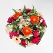 Radiating pure happiness, this joyful bouquet captures the essence of Gerrards Cross in full bloom, its vibrant hues and lush textures reflecting both celebration and abundance. At the centre, luminous orange gerberas shine with cheerful energy, their broad petals catching the light in much the same way as flowers along Packhorse Road on a bright summer morning. Plush magenta carnations and delicate blush roses cluster nearby, their velvety, sumptuous textures inviting touch and admiration. Sprays of white alstroemeria and miniature daisies glisten among the more saturated blooms, evoking the gentle refreshment of early morning dew. The surrounding greenery, generous yet restrained, frames the ensemble with glossy leaves reminiscent of the town's leafy, well-tended avenues. Crafted as a harmonious tapestry of colour and form, the bouquet offers visual delight and a fragrance where hints of sweet rose mingle with carnation's spice and the freshness of just-gathered greens. Perfect for marking birthdays, milestones, or spontaneous celebrations, this arrangement reflects the optimism, artistry, and community spirit that define Gerrards Cross. With every bloom chosen and placed by a florist deeply familiar with the area, the bouquet brings together a sense of local pride and the simple pleasure of nature's beauty, available for prompt delivery throughout the neighbourhood and beyond.