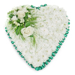 A beautifully composed heart-shaped sympathy tribute sits alone against a clean white background, its calm presence echoing the peaceful atmosphere of Gerrards Cross on a still morning. The heart is generously filled with white chrysanthemums, each bloom small yet plentiful, forming a thick, even blanket of petals that looks both soft and comforting to the touch. This continuous cushion of white flowers symbolises purity and quiet remembrance, offering a tender visual expression of condolence. Tracing the outline of the heart is an emerald green satin ribbon, expertly pleated so that the edges ripple in gentle ruffles. The ribbon's soft sheen contrasts gracefully with the matte, velvety flowers, creating a refined frame that clearly defines the heart's shape. In the upper left curve, a focal spray of larger blooms adds depth and meaning. Fully opened white roses, their petals gently curved and layered, take centre stage, representing love, devotion, and farewell. Around them, smaller white blossoms-perhaps freesias or similar airy flowers-along with clusters of buds introduce a sense of natural movement and unfolding life. A variety of green foliage, from polished broad leaves to feathery fronds that lightly trail over the chrysanthemum base, brings a lush, garden-like feel reminiscent of the nearby commons and wooded walks. The arrangement appears thoughtfully balanced and professionally designed, the kind of funeral heart families might request from a trusted local florist in Gerrards Cross for a church service, crematorium tribute, or graveside memorial. It communicates support, respect, and heartfelt sympathy in a quiet, dignified way.