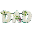 A dignified DAD funeral tribute is shown in clear detail, composed entirely of fresh white and green flowers that create a calm, respectful presence. Each of the three block letters is built on a sturdy frame, connected by discreet dark bars visible behind the flowers, ensuring the tribute can stand upright for display at a funeral or memorial gathering in Gerrards Cross. The front of every letter is densely covered with pristine white chrysanthemums or similar compact blooms, their neat, rounded petals forming a thick, cushion-like texture with no gaps, suggesting care and completeness. Surrounding this cloud of white is a ruffled border of emerald green ribbon, its satin surface gently catching the light and sharply defining the clean outlines of each letter against the bright white background.   

Soft, complementary floral sprays bring an added layer of artistry. On the upper left curve of the first D, a delicate cluster of white freesia blossoms and fresh green foliage sits lightly on the chrysanthemum base, giving a sense of fragrance and gentle movement. From this point, two long, curved green stems sweep diagonally across towards the centre of the tribute, guiding the eye to a striking focal design on the A. Here, two rich purple calla lilies, with their sleek, trumpet-shaped blooms, are tucked among more small white freesia flowers and glossy leaves, introducing a symbolic depth of colour that suggests reverence and quiet sorrow. The right-hand D is crowned on its upper right side with a smaller, matching cluster of white freesia and greenery, echoing the spray on the first letter and creating visual harmony.   

Carefully crafted by skilled local florists, this DAD tribute feels deeply personal, a tender message of love and remembrance suitable for services held in churches around Gerrards Cross or at nearby crematoria.