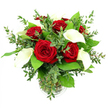 A sophisticated bouquet of rich red roses and elegant white calla lilies stands proudly in a simple clear glass vase, captured against a pure white background that emphasises its luxurious colours and textures. In the centre, about six or seven roses bloom fully, each flower a deep, velvety crimson with petals that spiral gracefully outward, evoking classic romance and heartfelt emotion. Woven among them, several calla lilies rise on smooth green stems, their long, trumpet-shaped blooms opening into creamy white cups that cradle slender yellow spadices, adding a serene, sculptural presence. Encircling the blooms is an abundance of greenery: airy eucalyptus with its rounded, silvery-green leaves arcs gently around the arrangement, lending a touch of wild garden charm, while broader dark-green leaves provide a strong, glossy base, framing the red and white flowers like a living picture. Inside the transparent vase, the stems are gathered neatly, immersed in clear water that reflects the light and underlines the arrangement's freshness. The lighting is bright and even, allowing subtle shadows to fall between petals and leaves, giving the bouquet depth without disturbing its calm, balanced feel. This arrangement feels ideal for life in Gerrards Cross, perhaps gracing a dining table in a home near Fulmer Road or sitting as a romantic surprise on a windowsill overlooking East Common. It's a design that suits anniversaries, Valentine's Day, or a quiet declaration of affection, the kind of flowers you might have delivered to someone special when you want beauty and sentiment to speak more clearly than words.