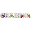 In this poignant sympathy arrangement, the word GRANDMA is spelled out in bold floral letters, resting in a straight line against a clean white backdrop, as if waiting to be placed at the front of a funeral or memorial service in Gerrards Cross. Every one of the seven letters is fully covered in small, pristine white cushion chrysanthemums, packed closely together so their rounded petals form a soft, pillowy surface - a gentle, comforting texture that speaks of purity and peace. Around the outer contours, a faint edging of pale lavender or light purple ribbon creates a subtle outline, helping each character stand out while adding a calm, soothing hint of colour. Rich red flowers are woven into the design like gems in a white tapestry. At the start of the tribute, the G holds a cluster of deep red roses and a distinctive red-and-white variegated calla-like bloom, drawing attention to where the message of love begins. The first A carries a single red anthurium, heart-shaped and glossy, resting near its base like a quiet symbol of devotion. Centrally placed, the M displays another gathering of velvety red roses partnered with a second red anthurium, reinforcing the theme of enduring affection, and the final A is finished with one more red anthurium, mirroring the earlier details and bringing the composition to a graceful close. All the letters are anchored by a discreet dark green framework that keeps them steady while staying mostly hidden. The overall effect is one of serene elegance and heartfelt remembrance, the kind of bespoke GRANDMA tribute a family in Gerrards Cross might choose to honour a grandmother's life with flowers that are fresh, dignified, and deeply meaningful.
