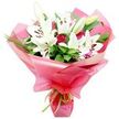 A sumptuous bouquet of white Oriental lilies and deep red roses is captured in crisp detail, evoking the feel of a hand-tied gift ready to be delivered to a doorstep in Gerrards Cross. Dominating the arrangement are several fully open lilies, their large, trumpet-shaped blooms glowing white against the neutral background. Each petal curves gracefully outward and slightly backward, showcasing the dark, rust-brown anthers at the centre that seem to float above the pale, velvety petals. Alongside these open florals, a scattering of tightly closed lily buds in soft green and cream injects a sense of newness and longevity, as if the bouquet will continue to evolve over the days ahead. Nestled among the lilies, clusters of dark red roses offer a rich, romantic counterpoint: some buds remain tightly furled, while others are just beginning to open, revealing spiralling layers of satin-textured petals. The blooms are cradled in a bed of lush green foliage, including broad, glossy leaves and slim, arching grass-like blades that lend structure and flow, reminiscent of the greenery around Gerrards Cross's leafy residential lanes and nearby commons. The stems are wrapped in a bold, bright pink cellophane or floral paper that catches the light, creating soft highlights and transparent overlaps that feel both festive and modern. At the base, a narrow lime green ribbon is tied neatly, its fresh, zesty hue echoing the natural greens of the leaves and providing a lively contrast to the pink. The bouquet conveys warmth, admiration, and celebration, making it ideal for anniversaries, Mother's Day surprises, or a thoughtful same-day delivery to mark a special moment in Gerrards Cross.