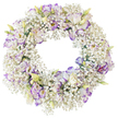 A serene floral wreath is presented alone against a stark white background, allowing every nuance of the flowers to stand out. The base of the wreath is entirely formed from airy Baby's Breath, thousands of minute white blossoms packed closely together so they resemble a continuous cloud encircling a clear open centre. Interlaced throughout this softness are striking Lisianthus blooms, their ruffled petals opening in layered whorls. The petals are pure white at heart, gradually meeting edges delicately brushed with lavender and purple-violet, like a faint twilight line on the horizon beyond Gerrards Cross. Some Lisianthus are fully open, displaying intricate folds and deeper centres, while others are still unfurling or remain in slim buds, tipped with pale green, creamy ivory and the faintest hint of yellow. The careful spacing of these larger flowers amongst the Baby's Breath creates a graceful rhythm around the ring, with touches of purple punctuating the white in a quiet, measured way. There are no bold leaves or extra embellishments, which keeps the focus on the interplay of texture and the gentle contrast of white and soft purple. The wreath's circular form, unmarred and symmetrical, symbolises eternity, ongoing love and the continuity of memory. It is easy to imagine this design used as a funeral tribute or memorial wreath for a service in Gerrards Cross, perhaps resting near a coffin or laid at a graveside as a final offering. The overall impression is one of purity, lightness and calm, conveying sympathy, respect and lasting affection through a beautifully restrained floral composition.