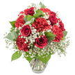 An opulent bouquet of red and white flowers is presented in a sleek, clear glass vase, isolated against a pristine white background that makes the colours appear intensely vivid. At the core are plush red roses, their petals densely packed into elegant spirals, some still in tight bud and others just beginning to open, each one a focal point of classic romance. Intermingled with the roses are abundant red carnations, their ruffled, feathery petals creating a soft, billowing texture that seems to overflow from the vase, giving the design a generous, almost overflowing feel. Threaded throughout the bouquet are plentiful stems of pure white baby's breath, forming airy clusters that float among the red blooms and introduce a sense of lightness and innocence. Eucalyptus and other greenery in rich and muted greens curve gently between the blossoms, adding structure, natural movement, and a cooling counterpoint to the warm red tones. The glass vase itself is simple with a slightly flared rim, holding the neatly trimmed stems in clear water that glints under the bright, even studio lighting. Every detail is visible-from the subtle sheen on the rose petals to the intricate folds of each carnation and the tiny, star-like faces of the gypsophila-reminiscent of a bouquet freshly arranged in a Gerrards Cross flower shop before heading out for delivery towards the common or down Oxford Road. The mood of the arrangement is both intimate and celebratory, ideal for a romantic gesture, a special anniversary dinner, or a meaningful gift that brings warmth and elegance into homes across Gerrards Cross.