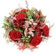 Viewed from directly above, this abundant round bouquet looks like a rich pool of crimson and pink against a stark white background, each bloom carefully positioned to create harmony and depth. At the centre and throughout, velvety deep red roses open fully, their spiralled petals showcasing the classic symbol of romance in its most opulent form. Between these larger heads, sprays of pale pink waxflower weave an airy network of tiny, star-shaped blossoms, their subtle yellow centres catching the light and softening the stronger reds. A generous collar of vibrant green foliage supports the flowers, with broad, glossy leaves and finer, more delicate greenery combining to give the bouquet a sense of fullness and fresh vitality, as if just arranged in a Gerrards Cross florist's studio. Interspersed among the greens are distinctive burgundy and bronze-tinted leaves, some etched with reddish-brown veins, which introduce a warm, autumnal nuance and a touch of contemporary style. Smaller, darker red blooms, reminiscent of alstroemeria or similar bell-shaped flowers, peek out between the roses, deepening the crimson tones and enhancing the textural layering. At the lower edge, a sliver of red and white patterned tag or ribbon is just visible, hinting that this is a thoughtful gift, perhaps ready for same-day delivery around Packhorse Road or a romantic surprise near Bulstrode Park. The lighting is soft and even, free of harsh shadows, allowing the reds to appear sumptuous and the greens crisp and lively. Overall, the bouquet radiates emotion and sophistication, ideal for anniversaries, festive occasions, or any moment in Gerrards Cross when words alone don't feel quite enough.