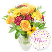 A bright, celebratory gift ensemble pictured against a clean white backdrop: a loose, garden-style bouquet in a clear glass vase sits to the left with a round white foil balloon nestled to the lower right. The arrangement is warm in tone - large, peachy to deep orange roses with gently unfurling petals form the visual heart, their soft, velvety faces catching a hint of soft morning light. Around them, sunny yellow gerbera daisies open like small suns, their dark central disks giving crisp contrast to the blooms. Deep maroon carnations, densely ruffled and plush, add shadowed depth and a tactile, velour-like texture. Sprays of delicate white alstroemeria (Peruvian lilies) lift the palette with slender, freckled petals that bring an airy, refined note. A generous cloud of glossy green foliage-broad leaves and slender sprigs-frames the flowers and shows through the transparent vase, where neatly cut stems and clear water speak to freshness. The balloon is glossy white Mylar, playfully scattered with gold and hot-pink confetti dots and tiny hearts; across its centre a flowing hot-pink script reads best Mum, the words swooping with affectionate handwriting. The overall impression is joyful and intimate, a floral tribute that smells faintly of classic tea-rose perfume and feels both substantial and tender to hold. As a local florist's composition, this pairing-flowers plus a personalised balloon-is a thoughtful choice for Mother's Day, birthdays, or as a token of gratitude for a special mum in Gerrards Cross near the High Street and the Common.